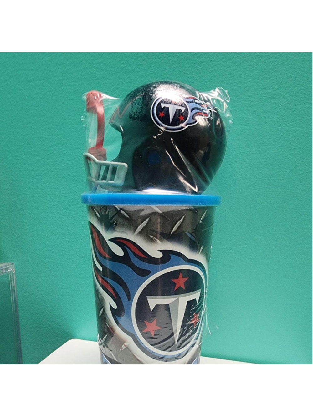 NFL Tennessee Titans tumbler with blue, red, and white flame design and team log
